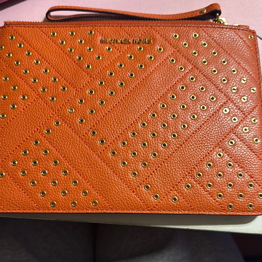 Michael Kors Orange Clutch with Perforated Design